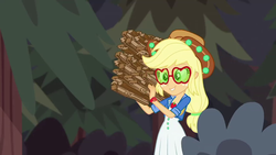 Size: 1280x720 | Tagged: safe, screencap, applejack, equestria girls, g4, my little pony equestria girls: choose your own ending, wake up!, wake up!: applejack, applejack's festival hat, applejack's sunglasses, bush, carrying, clothes, dress, female, geode of super strength, hat, magical geodes, outdoors, smiling, solo, sunglasses, tree, wood, working