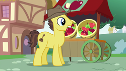 Size: 1920x1080 | Tagged: safe, screencap, country roads, earth pony, pony, g4, the last crusade, apple, apple cart, background pony, food, hat, male, mouth hold, ponyville, solo, stallion