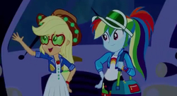 Size: 640x347 | Tagged: safe, screencap, applejack, rainbow dash, equestria girls, equestria girls specials, g4, my little pony equestria girls: better together, my little pony equestria girls: sunset's backstage pass, female, music festival outfit