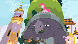 Size: 1811x1019 | Tagged: safe, screencap, applejack, fluttershy, mr. tortoisnap, pinkie pie, earth pony, pegasus, pony, tortoise, between dark and dawn, g4, canterlot, chewing, discovery family logo, eating, female, giant tortoise, mare, outdoors, tower, trash, tree, zaratan