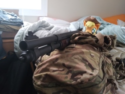 Size: 4160x3120 | Tagged: safe, applejack, earth pony, pony, g4, 4de, applejack's hat, backpack, bed, cowboy hat, female, gun, hat, irl, mare, mossberg 590a1, my little arsenal, photo, plushie, ponies with guns, shotgun, solo, weapon