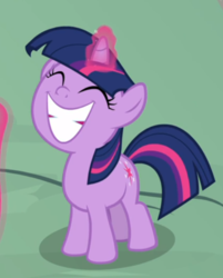 Size: 551x687 | Tagged: safe, screencap, twilight sparkle, pony, unicorn, g4, sparkle's seven, cropped, cute, eyes closed, female, filly, filly twilight sparkle, glowing horn, horn, proud, smiling, solo, teeth, twiabetes, unicorn twilight, younger