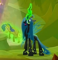 Size: 332x344 | Tagged: safe, screencap, queen chrysalis, changeling, changeling queen, frenemies (episode), g4, better way to be bad, cropped, female, glowing horn, happy, horn, looking at you, magic, rarity plushie, singing, solo, telekinesis