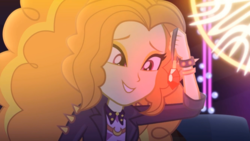 Size: 1027x578 | Tagged: safe, screencap, adagio dazzle, equestria girls, find the magic, g4, my little pony equestria girls: better together, adoragio, beautiful, bracelet, clothes, cute, female, gem, jacket, jewelry, leather jacket, looking at something, siren gem, smiling, solo, spiked wristband, when she smiles, wristband