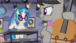 Size: 1669x941 | Tagged: safe, screencap, dj pon-3, octavia melody, vinyl scratch, earth pony, pony, unicorn, g4, slice of life (episode), background pony, bipedal, bow, bow (instrument), cello, cropped, disco ball, duo, evil smile, female, grin, headphones, looking at each other, mare, musical instrument, playing instrument, smiling, smirk, synthesizer, turntable
