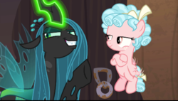 Size: 498x282 | Tagged: safe, screencap, cozy glow, queen chrysalis, changeling, changeling queen, g4, the summer sun setback, bow, crossed hooves, evil grin, fangs, female, filly, flapping, foal, former queen chrysalis, freckles, glowing horn, grin, hair bow, horn, lidded eyes, magic, raised eyebrow, smiling