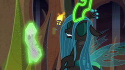 Size: 1920x1080 | Tagged: safe, screencap, queen chrysalis, changeling, changeling queen, frenemies (episode), g4, eyes closed, female, glowing horn, hoof on chest, horn, log, magic, magic aura, solo, telekinesis, torch