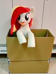 Size: 768x1024 | Tagged: safe, artist:nekokevin, oc, oc only, oc:poniko, earth pony, pony, box, female, irl, looking at you, mare, photo, plushie, pony in a box, smiling, solo, tongue out