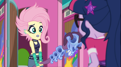 Size: 1926x1080 | Tagged: safe, screencap, fluttershy, sci-twi, twilight sparkle, equestria girls, g4, my little pony equestria girls: choose your own ending, the road less scheduled, the road less scheduled: fluttershy, alternate hairstyle, choker, clothes, crystal skull staff, duo, duo female, ear piercing, earring, eyeliner, eyeshadow, female, flutterpunk, geode of telekinesis, glasses, goth, jewelry, lipstick, magical geodes, makeup, metalshy, midriff, piercing, purple lipstick, skull, sleeveless, staff, tank top