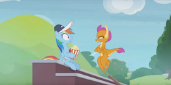 Size: 1224x614 | Tagged: safe, screencap, rainbow dash, smolder, dragon, pegasus, pony, 2 4 6 greaaat, g4, claws, coach, coach rainbow dash, dragoness, duo, female, flapping, flying, folded wings, food, hat, horns, mare, narrowed eyes, popcorn, shrunken pupils, sitting, smolder is not amused, spread wings, squint, teenaged dragon, teenager, wide eyes, wings