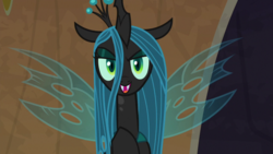 Size: 1920x1080 | Tagged: safe, screencap, queen chrysalis, changeling, changeling queen, frenemies (episode), g4, crown, evil lair, eyeshadow, fangs, female, former queen chrysalis, grogar's lair, insect wings, jewelry, lair, makeup, quadrupedal, regalia, slit pupils, solo, spread wings, wings