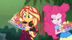 Size: 1914x1080 | Tagged: safe, screencap, pinkie pie, sunset shimmer, equestria girls, g4, my little pony equestria girls: choose your own ending, wake up!, wake up!: pinkie pie, bread, cake, candy, croissant, donut, duo, duo female, female, food, frosting, imminent consumption, imminent stuffing, jelly beans, junk food, music festival outfit, outdoors, pastries, pastry, this will end in diabetes, this will end in tummy aches, this will end in weight gain, this will not end well, waffle