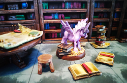 Size: 1200x785 | Tagged: safe, artist:velgarn, derpibooru exclusive, twilight sparkle, alicorn, pony, g4, book, bookhorse, bookshelf, excited, female, figurine, gaming miniature, library, map, miniature, pewter ponies, photo, pile of books, scenery, solo, stool, table, twilight sparkle (alicorn)