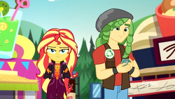 Size: 1280x720 | Tagged: safe, screencap, sandalwood, sunset shimmer, equestria girls, equestria girls specials, g4, my little pony equestria girls: better together, my little pony equestria girls: sunset's backstage pass, cellphone, clothes, geode of empathy, jacket, magical geodes, music festival outfit, pants, phone, smartphone, smiling, upset