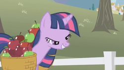 Size: 1334x750 | Tagged: safe, screencap, twilight sparkle, pony, unicorn, g4, season 1, the ticket master, apple, food, great moments in animation, midblink, paused moment, smiling, twilight sparkle is best facemaker, unicorn twilight