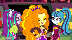 Size: 1912x1080 | Tagged: safe, screencap, adagio dazzle, aria blaze, sonata dusk, equestria girls, equestria girls series, g4, sunset's backstage pass!, spoiler:eqg series (season 2), clothes, dress, female, lidded eyes, minidress, open mouth, outdoors, pigtails, ponytail, raised eyebrow, smiling, spiked wristband, taco dress, the dazzlings, the dazzlings tour bus, trio, trio female, twintails, wristband