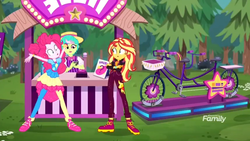 Size: 1366x768 | Tagged: safe, screencap, belle barker, pinkie pie, sunset shimmer, equestria girls, equestria girls series, g4, sunset's backstage pass!, spoiler:eqg series (season 2), bicycle, booth, carny, discovery family logo, forest, geode of empathy, geode of sugar bombs, joy buzzer, magical geodes, prize, shoes, sneakers, tandem bicycle