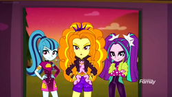 Size: 1366x768 | Tagged: safe, screencap, adagio dazzle, aria blaze, sonata dusk, equestria girls, equestria girls series, g4, sunset's backstage pass!, spoiler:eqg series (season 2), crossed arms, discovery family logo, hand on hip, smiling, smirk, the dazzlings, the dazzlings tour bus