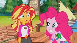 Size: 1280x720 | Tagged: safe, screencap, pinkie pie, sunset shimmer, equestria girls, g4, my little pony equestria girls: legend of everfree, belt, boat, camp everfree outfits, confused, discovery kids, duo, duo female, female, grin, smiling