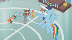 Size: 1362x766 | Tagged: safe, screencap, lighthoof, ocellus, rainbow dash, shimmy shake, smolder, snips, yona, pony, yak, 2 4 6 greaaat, g4, blurry, cap, coach rainbow dash, face paint, flying, gym, hat, podium, top hat, unsure, whistle