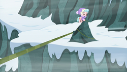 Size: 1280x720 | Tagged: safe, screencap, cozy glow, pegasus, pony, frenemies (episode), g4, clothes, female, filly, flying, foal, hat, rope, snow, solo, winter outfit