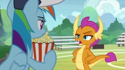 Size: 1920x1080 | Tagged: safe, screencap, rainbow dash, smolder, dragon, pony, 2 4 6 greaaat, g4, cap, claws, coach, coach rainbow dash, dragoness, female, food, frown, hand on hip, hat, open mouth, popcorn, raised eyebrow, smolder is not amused, teacher and student, unamused