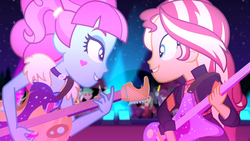 Size: 1916x1080 | Tagged: safe, screencap, curly winds, kiwi lollipop, lemon zack, sandalwood, some blue guy, sunset shimmer, track starr, equestria girls, equestria girls series, g4, sunset's backstage pass!, spoiler:eqg series (season 2), background human, concert, duo, duo female, electric guitar, female, glowstick, guitar, k-lo, looking at each other, male, musical instrument, true original (song)