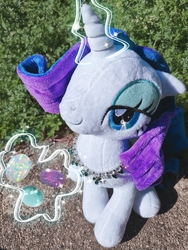 Size: 2449x3265 | Tagged: safe, rarity, pony, unicorn, g4, doll, female, glowing horn, high res, horn, irl, magic, mare, outdoors, photo, plushie, solo, telekinesis, toy