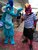 Size: 3120x4160 | Tagged: safe, garble, princess ember, human, bronycon, bronycon 2019, g4, clothes, cosplay, costume, fursuit, fursuit head, irl, irl human, photo, pointing