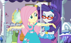Size: 1598x970 | Tagged: safe, screencap, fluttershy, rarity, costume conundrum, costume conundrum: rarity, equestria girls, g4, my little pony equestria girls: choose your own ending, bed, bracelet, clothes rack, cropped, duo, duo female, eyeshadow, female, fluttershy boho dress, geode of fauna, geode of shielding, glasses, jewelry, lidded eyes, magical geodes, makeup, measuring, measuring tape, rarity's bedroom, rarity's glasses