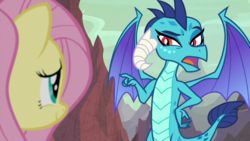 Size: 1920x1080 | Tagged: safe, screencap, fluttershy, princess ember, dragon, pony, g4, sweet and smoky, dragoness, duo, female, mare, pointing
