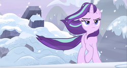 Size: 1917x1031 | Tagged: safe, screencap, starlight glimmer, pony, unicorn, g4, the ending of the end, badass, female, frown, lidded eyes, like a boss, mare, raised hoof, snow, solo, walking away, windswept mane