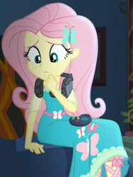 Size: 719x958 | Tagged: safe, screencap, fluttershy, costume conundrum, equestria girls, g4, my little pony equestria girls: choose your own ending, controller, couch, cropped, cute, female, gaming headset, geode of fauna, headset, headset mic, looking down, magical geodes, sitting, solo, sunset's apartment, thinking