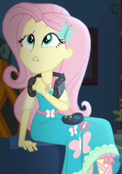 Size: 673x964 | Tagged: safe, screencap, fluttershy, costume conundrum, equestria girls, equestria girls series, g4, spoiler:choose your own ending (season 2), spoiler:eqg series (season 2), controller, couch, cropped, female, geode of fauna, headset, headset mic, magical geodes, sitting, solo, sunset's apartment, thinking