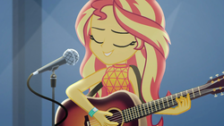 Size: 1910x1074 | Tagged: safe, screencap, sunset shimmer, equestria girls, g4, let it rain, my little pony equestria girls: better together, acoustic guitar, beautiful, eyes closed, female, guitar, microphone, microphone stand, musical instrument, singing, smiling