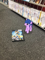 Size: 3024x4032 | Tagged: safe, photographer:undeadponysoldier, twilight sparkle, pony, unicorn, g4, box art, female, game rating, gamecube, mare, solo, the game father, tiny, tiny ponies, unicorn twilight, whirl tour, wii