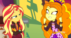 Size: 1920x1020 | Tagged: safe, screencap, adagio dazzle, sunset shimmer, equestria girls, equestria girls series, g4, sunset's backstage pass!, spoiler:eqg series (season 2), angry, discovery family logo, duo, duo female, female, smiling, smirk, smug, smugset shimmer, spiked wristband, wristband