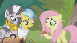 Size: 1675x946 | Tagged: safe, screencap, doctor fauna, fluttershy, zecora, earth pony, fire lizard, gecko, pegasus, pony, zebra, g4, she talks to angel, bags under eyes, clothes, ear piercing, earring, female, forest, jewelry, lidded eyes, mare, messy mane, neck rings, piercing, quadrupedal