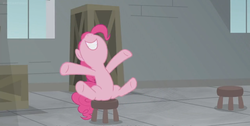 Size: 1366x686 | Tagged: safe, screencap, pinkie pie, pony, g4, the last laugh, box, crate, factory, female, gag factory, mare, sitting, smiling, solo, stool, window