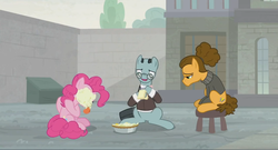 Size: 1366x740 | Tagged: safe, screencap, cheese sandwich, pinkie pie, sans smirk, g4, the last laugh, alternate hairstyle, clothes, depressed, dumpster, factory, food, gag factory, glasses, hair bun, notepad, pencil, pie, pie in the face, sad, sitting, stool, suit, taking notes, tongue out, walls, writing
