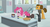 Size: 1366x740 | Tagged: safe, screencap, cheese sandwich, pinkie pie, sans smirk, g4, the last laugh, alternate hairstyle, clothes, cute, diapinkes, factory, food, gag factory, glasses, hair bun, laboratory, peanut brittle, pie, sad, science lab, shelf, suit