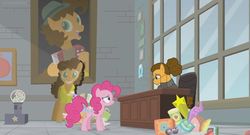 Size: 1366x738 | Tagged: safe, screencap, cheese sandwich, pinkie pie, pony, g4, the last laugh, alternate hairstyle, bust, cardboard cutout, chair, clothes, factory, gag factory, gumball machine, hair bun, hoof on cheek, office, picture frame, portrait, sad, sweater, toy, window