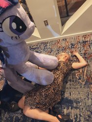 Size: 1536x2048 | Tagged: safe, twilight sparkle, human, bronycon, bronycon 2019, g4, andrea libman, defeated, irl, irl human, photo, plushie, pure unfiltered evil, the weak should fear the strong