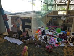 Size: 2048x1536 | Tagged: safe, artist:brandonstubner, photographer:brandonstubner, applejack, fluttershy, rarity, pony, bronycon, bronycon 2019, g4, 2019, anyway come to trotcon, bronycon shrine, end of bronycon, f, irl, meme, party cannon, photo, press f to pay respects, rocket launcher, shrine, united states