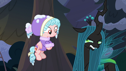 Size: 1280x720 | Tagged: safe, screencap, cozy glow, queen chrysalis, changeling, changeling queen, pegasus, pony, frenemies (episode), g4, clothes, duo, female, filly, flying, foal, forest, hat, winter outfit