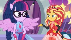 Size: 1080x606 | Tagged: safe, screencap, sci-twi, sunset shimmer, twilight sparkle, human, equestria girls, equestria girls series, g4, rollercoaster of friendship, duo, eye contact, glasses, looking at each other, ponied up, smiling, super ponied up