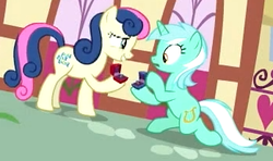 Size: 349x206 | Tagged: safe, screencap, bon bon, lyra heartstrings, sweetie drops, earth pony, pony, unicorn, g4, the big mac question, background characters doing background things, background pony, duo, female, it finally happened, it happened, lesbian, mare, marriage proposal, ship:lyrabon, shipping, will you marry me
