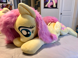 Size: 4032x3024 | Tagged: safe, artist:natureshy, artist:qtpony, fluttershy, pony, g4, cute, female, irl, life size, lying on bed, photo, plushie, prone, shyabetes