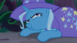 Size: 1280x720 | Tagged: safe, screencap, trixie, pony, unicorn, g4, student counsel, cape, chewing, clothes, eating, female, forest, hat, mare, munching, nose wrinkle, prone, solo, trixie's cape, trixie's hat