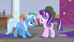 Size: 1920x1080 | Tagged: safe, screencap, starlight glimmer, trixie, pony, unicorn, a horse shoe-in, g4, crouching, discovery family logo, eye contact, female, looking at each other, mare, school of friendship, smiling, twilight's office, wide eyes